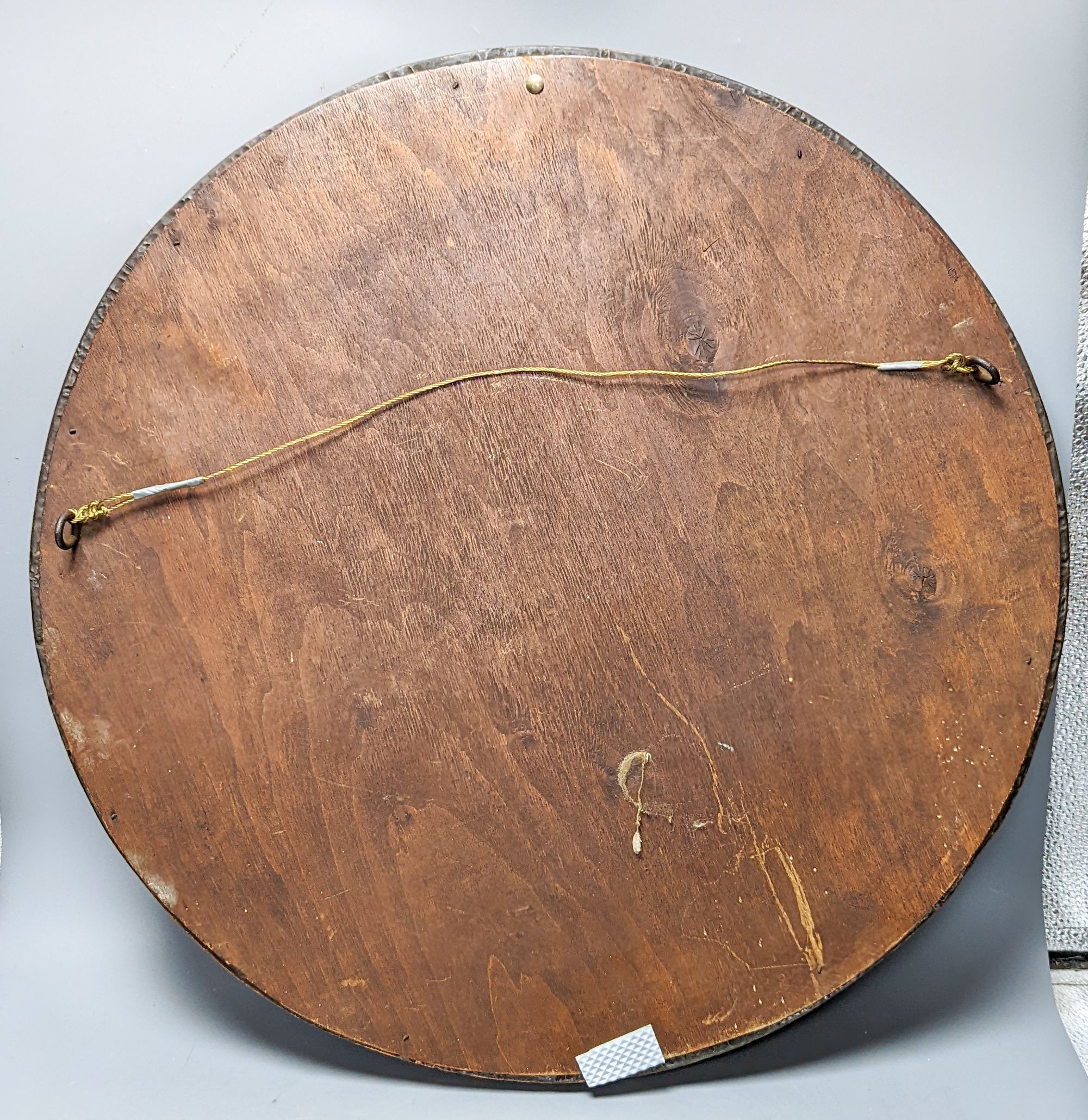 An Arts & Crafts circular copper mirror 56cm
